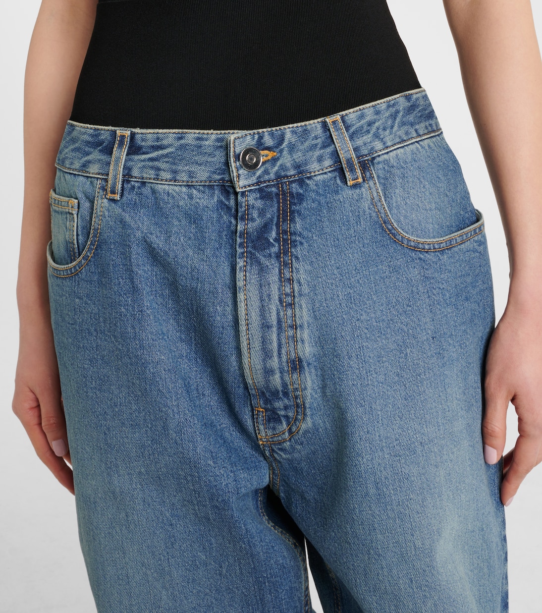 Jeans cropped con gamba arrotondata | Alaïa