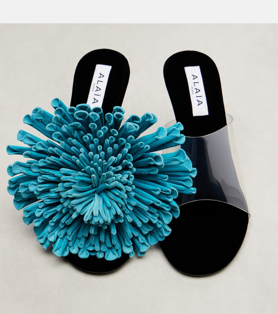 Mules 90 en cuir et PU à fleur | Alaïa