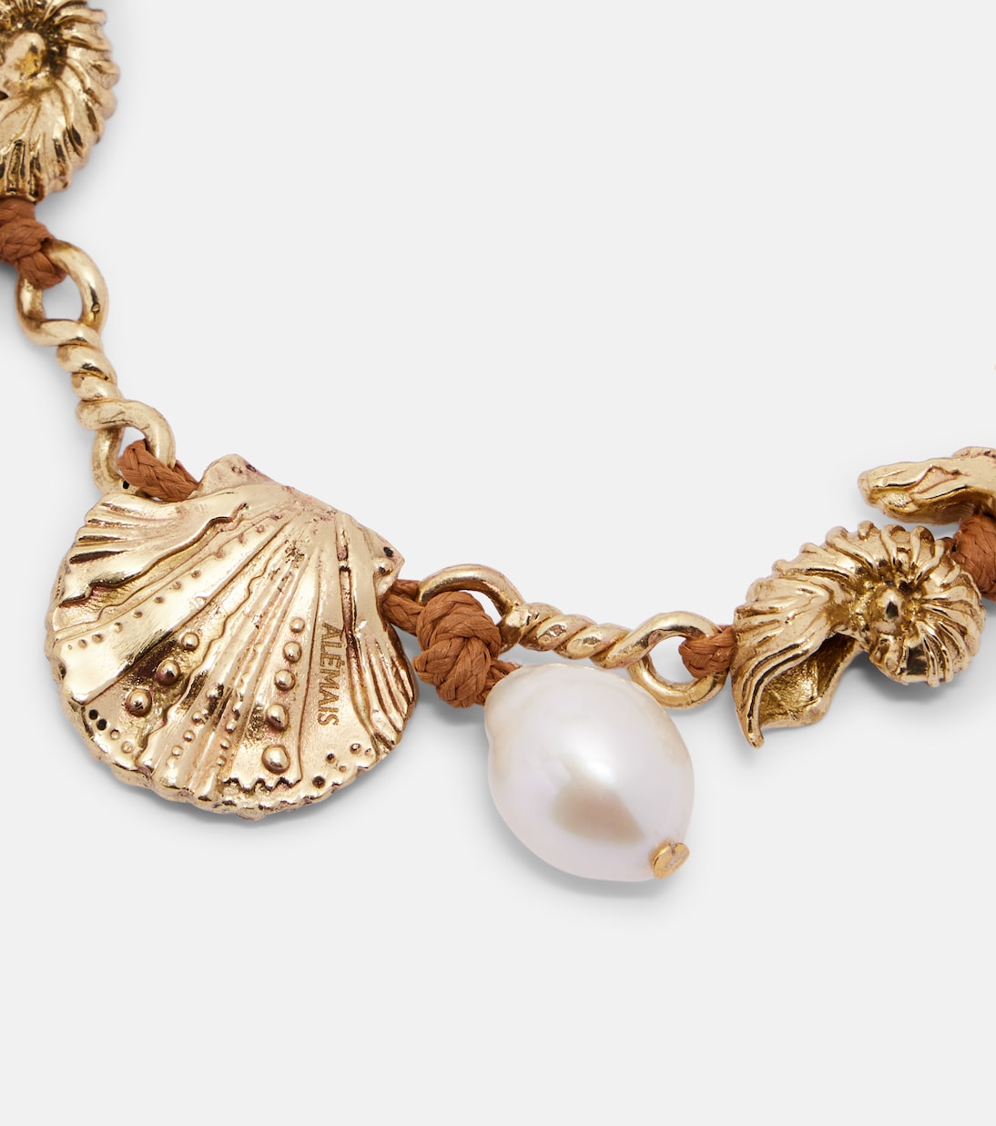 Faux pearl embellished charm bracelet | Alémais