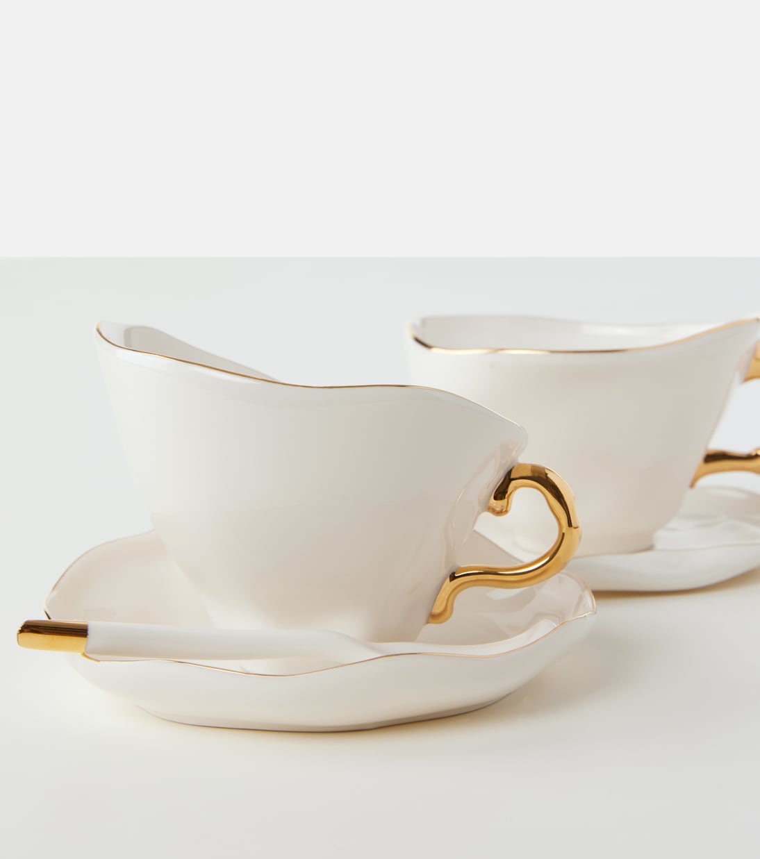 Meltdown set of 2 teacups, saucers, and spoons by JordanLuca | Seletti