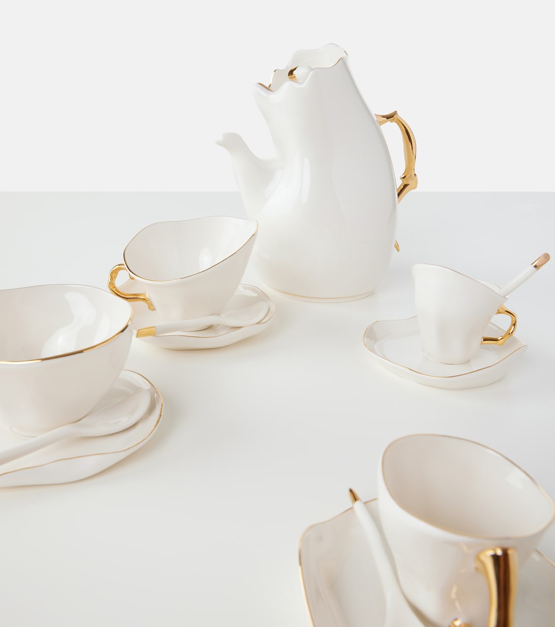 Meltdown set of 2 teacups, saucers, and spoons by JordanLuca | Seletti