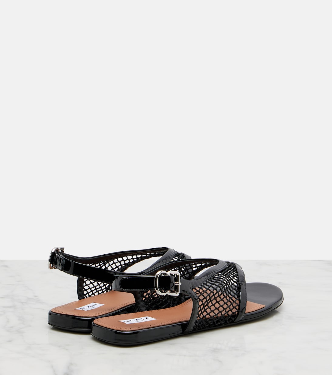 Fishnet leather-trimmed thong sandals | Alaïa