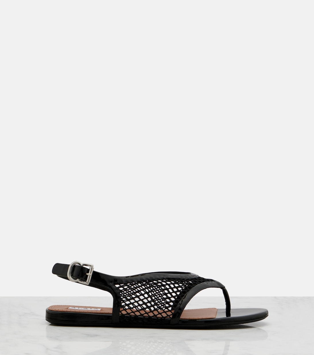 Fishnet leather-trimmed thong sandals | Alaïa