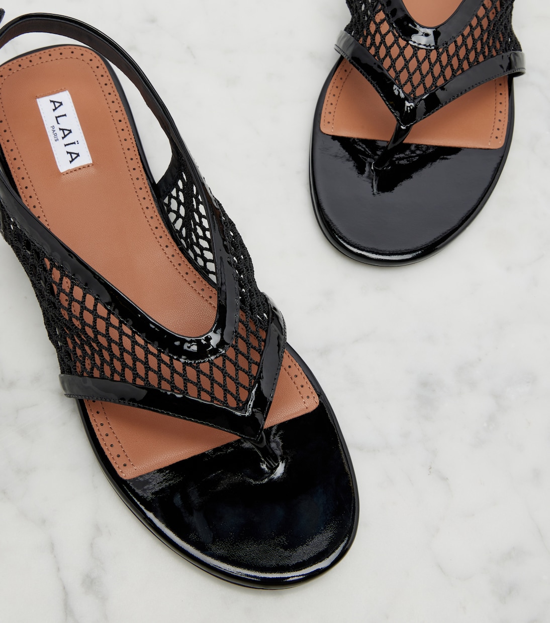 Fishnet leather-trimmed thong sandals | Alaïa