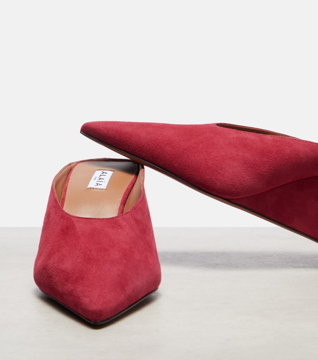 Mules Cube 75 in suede con zeppa | Alaïa