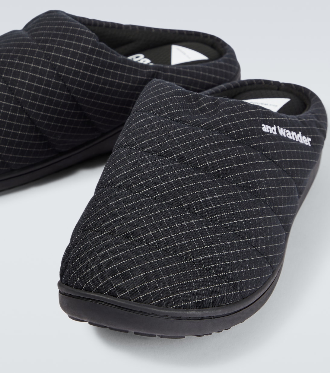 x Subu striped padded slippers | And Wander