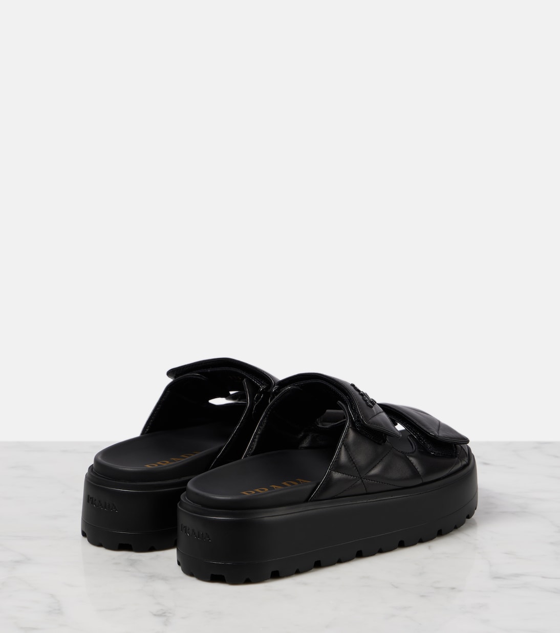 Quilted leather platform sandals | Prada