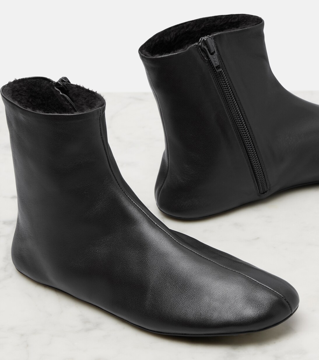 Stella shearling-lined leather ankle boots | The Row