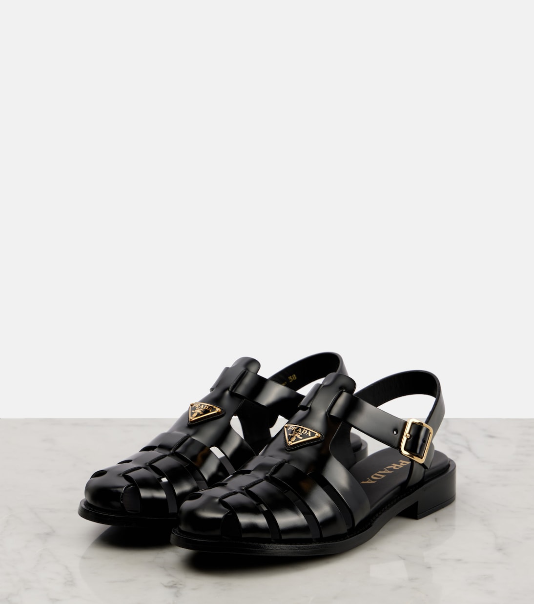 Brushed leather fisherman sandals | Prada