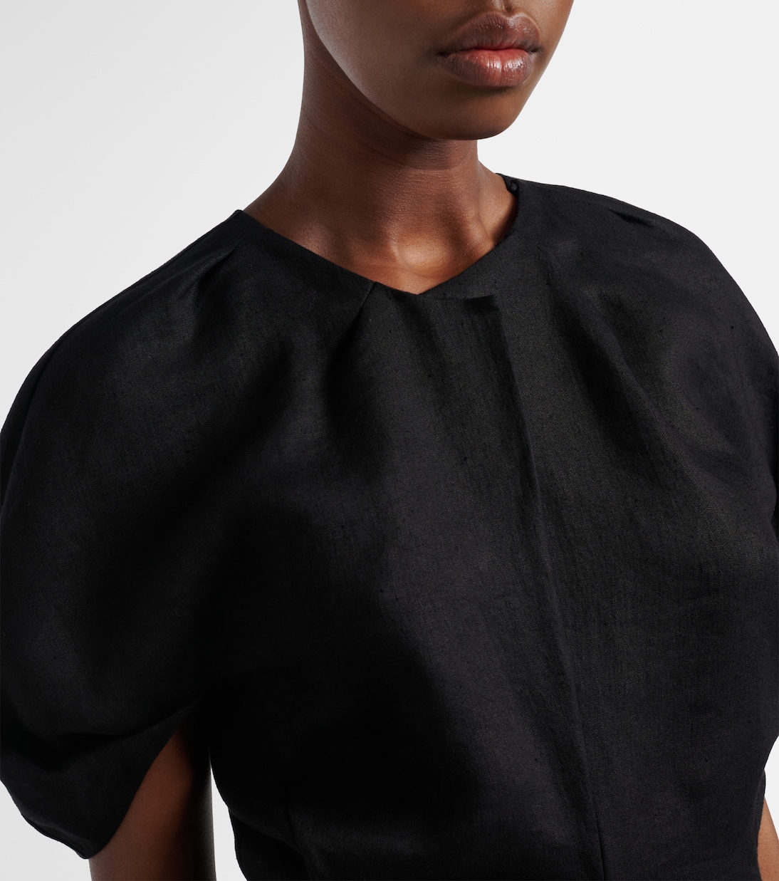 Rumi peplum linen-blend top | Khaite