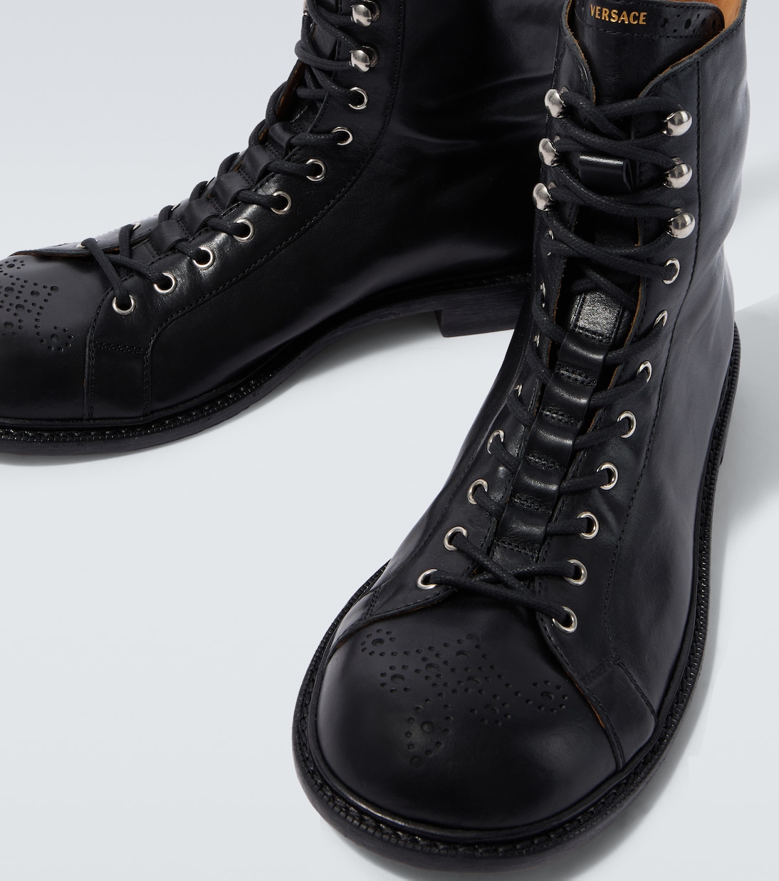 Billy perforated leather combat boots | Versace