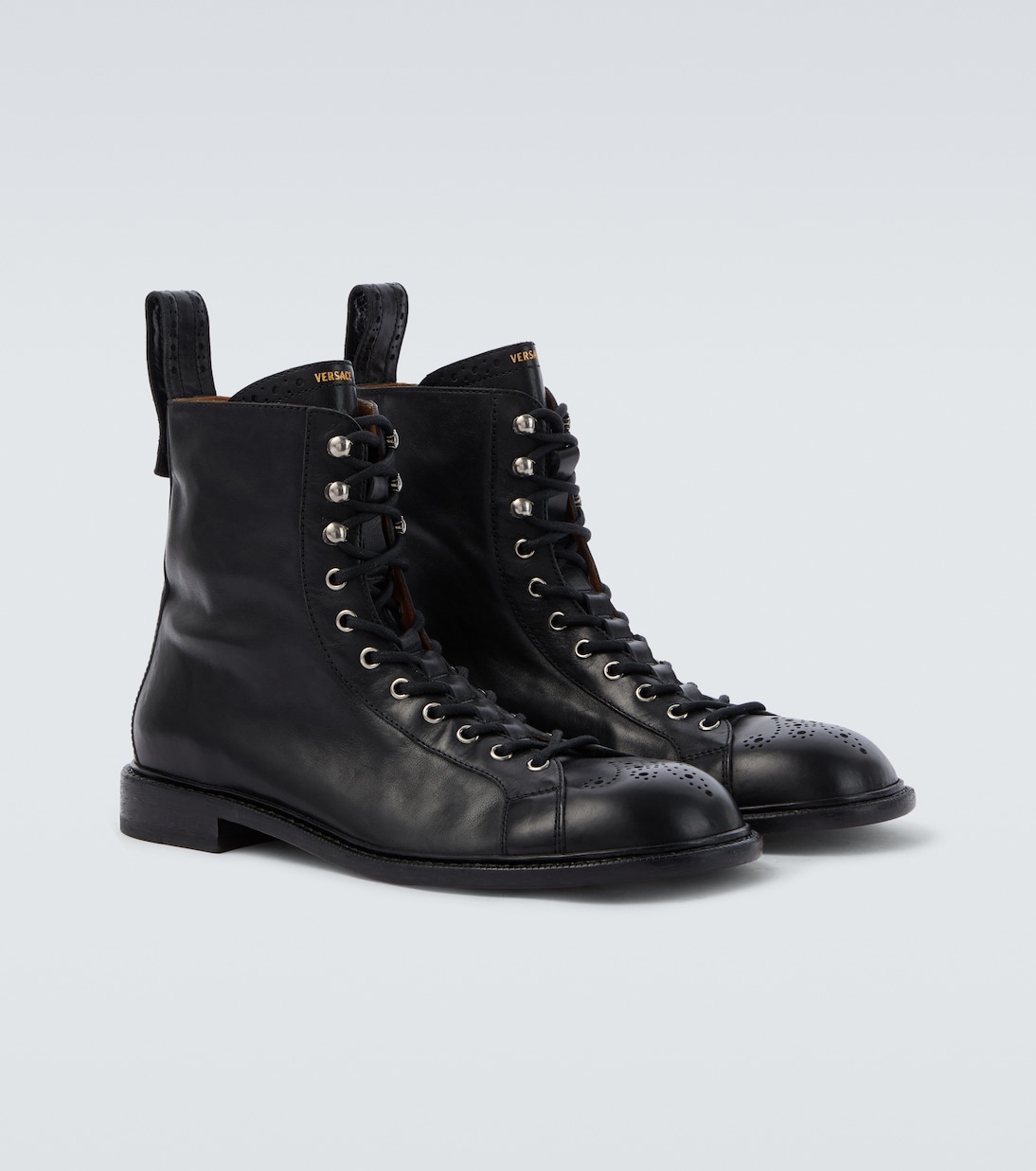 Billy perforated leather combat boots | Versace