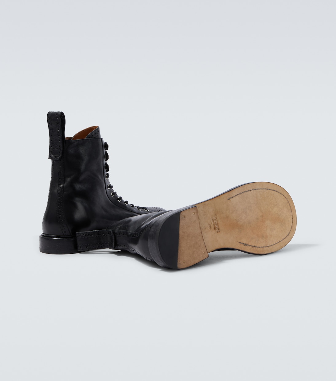 Billy perforated leather combat boots | Versace