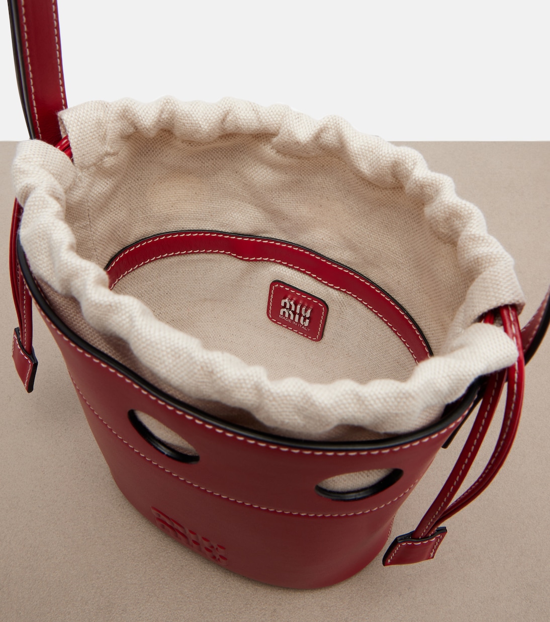 Cutout leather bucket bag | Miu Miu