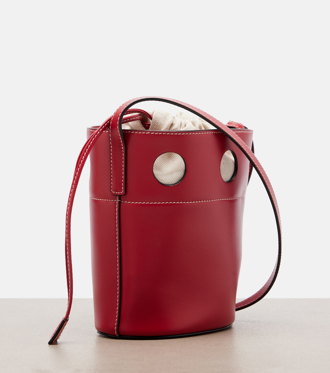 Cutout leather bucket bag | Miu Miu
