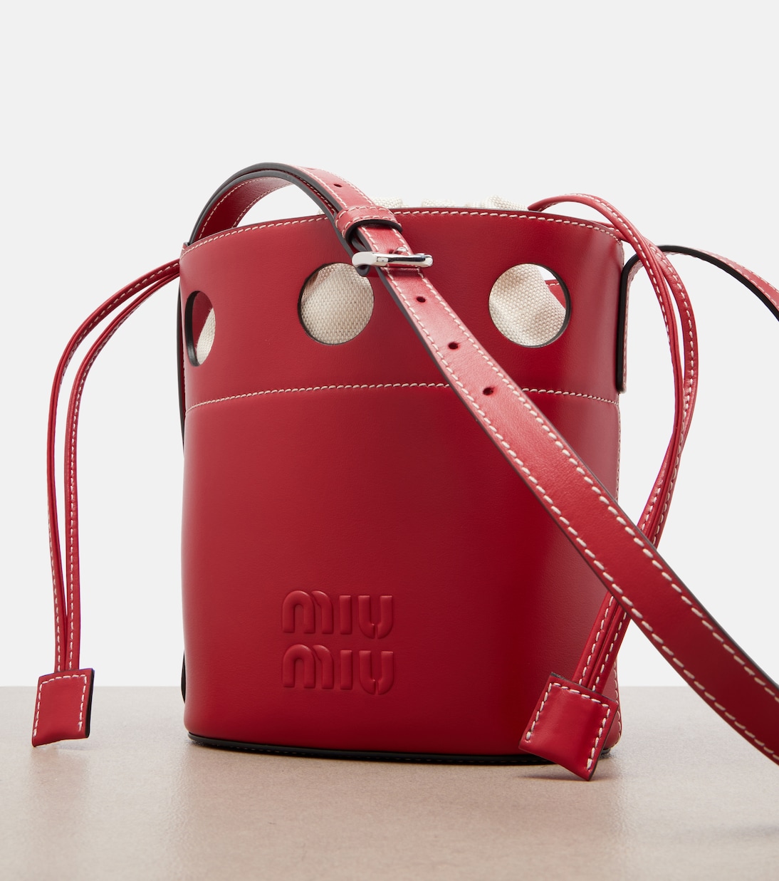 Cutout leather bucket bag | Miu Miu