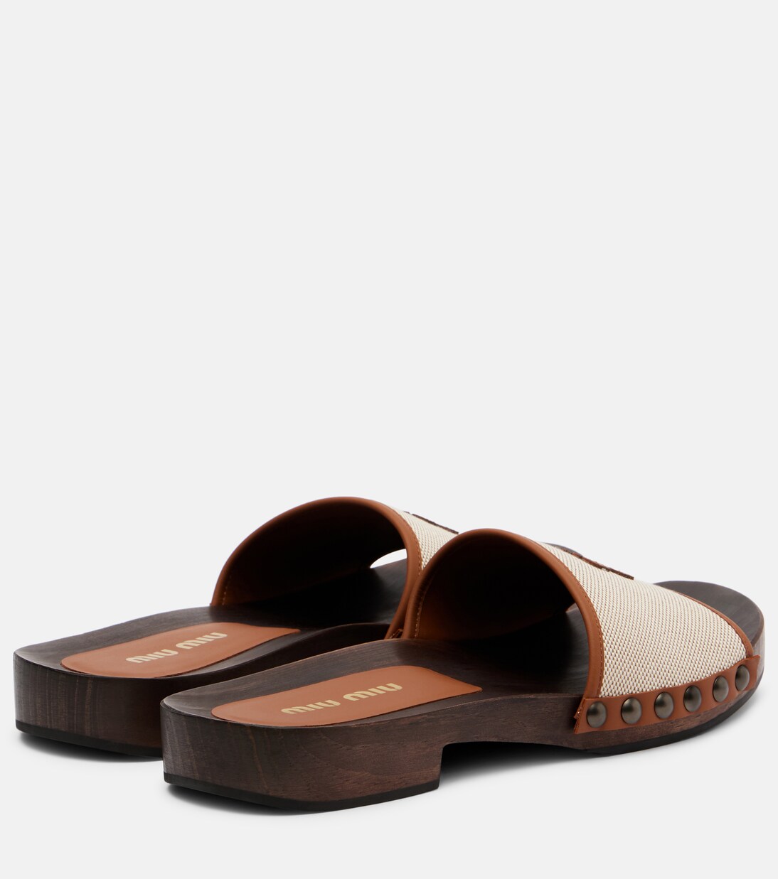 Logo leather-trimmed canvas clogs | Miu Miu