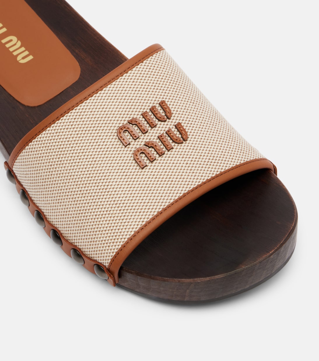 Logo leather-trimmed canvas clogs | Miu Miu