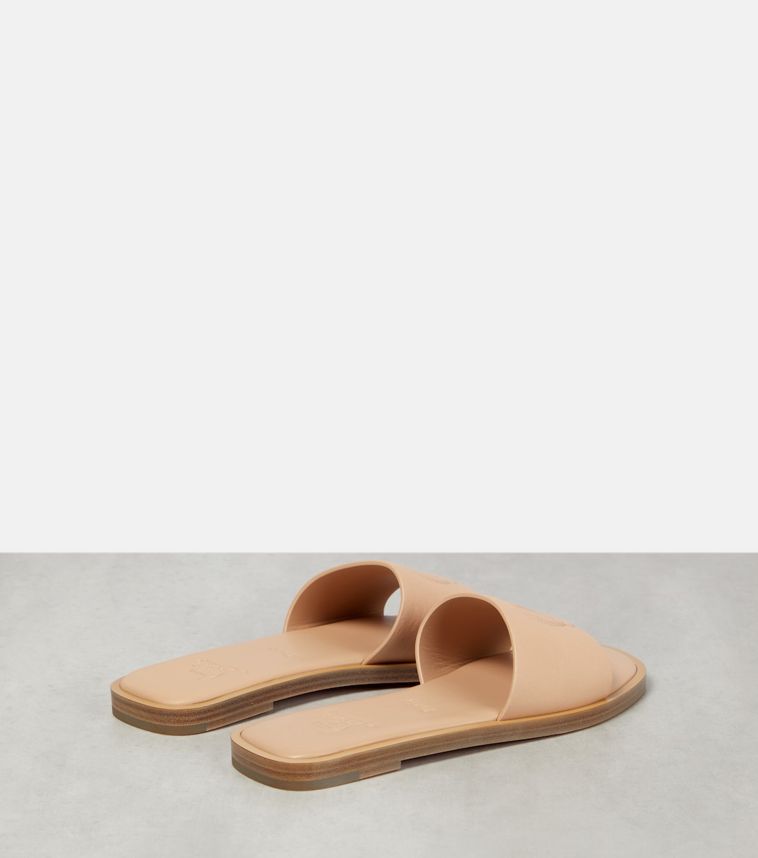CL embossed leather slides | Christian Louboutin