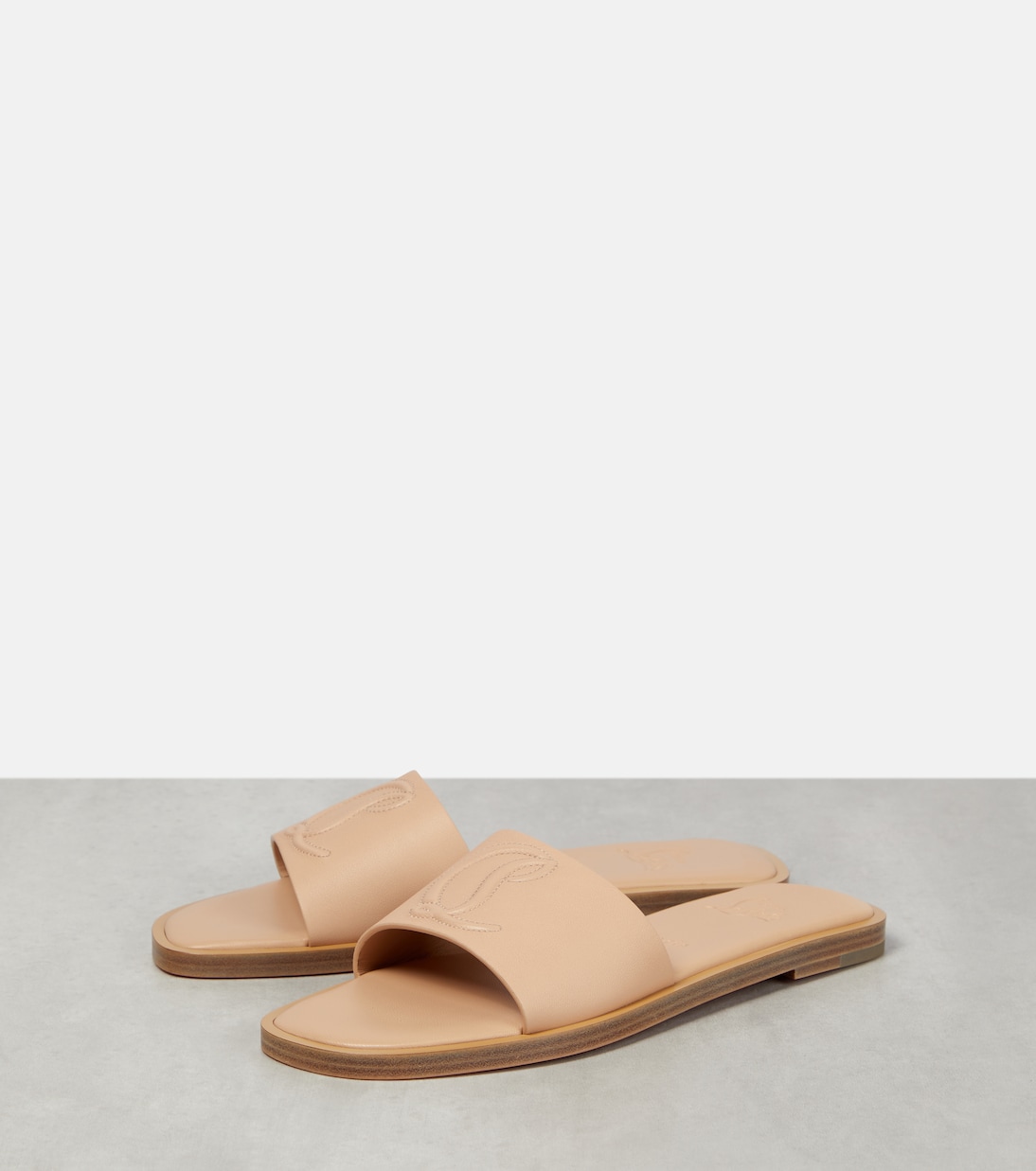 CL embossed leather slides | Christian Louboutin