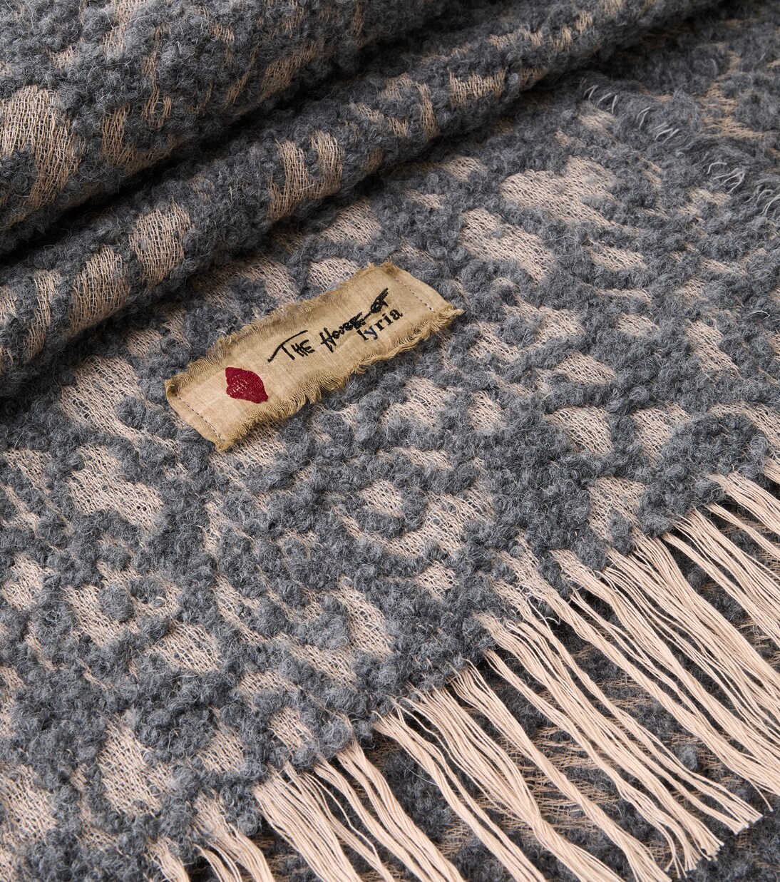 Malghe wool and cotton-blend throw | The House of Lyria