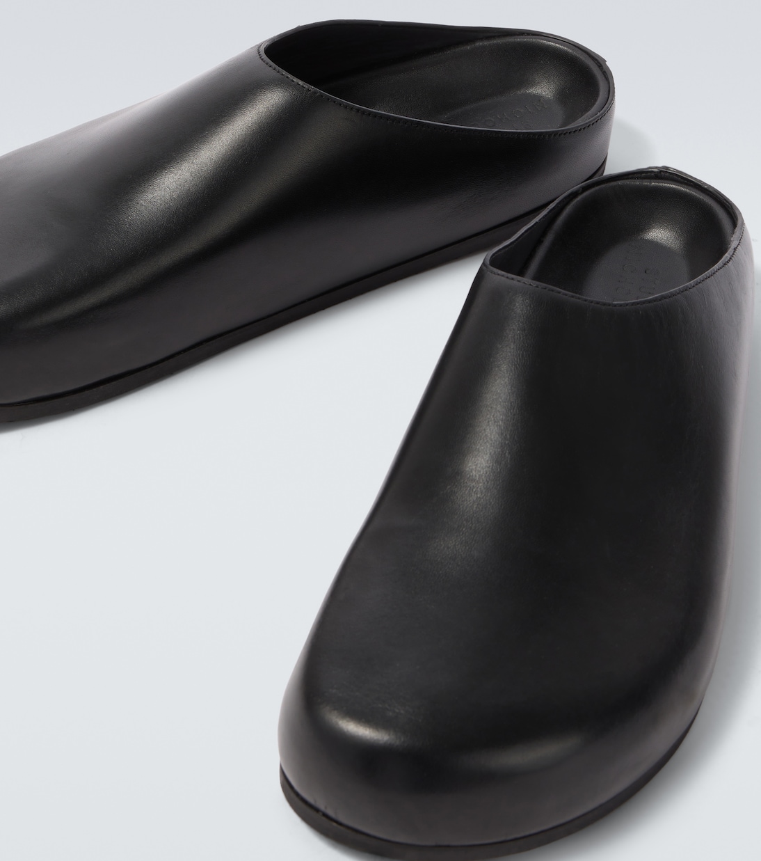 Wearing leather mules | Studio Nicholson