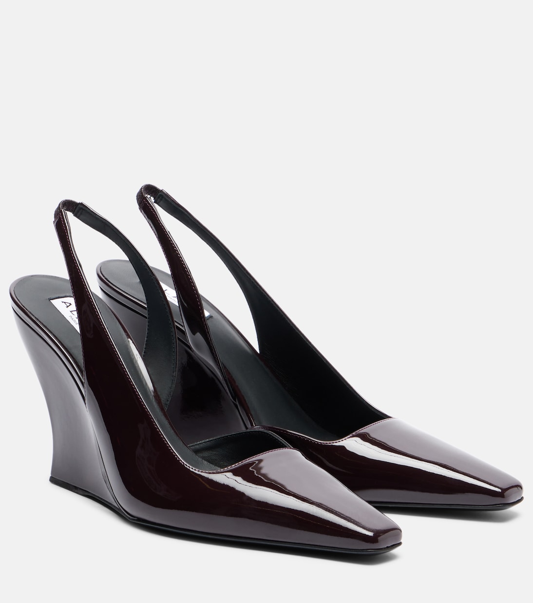 Patent leather wedge slingback pumps | Alaïa