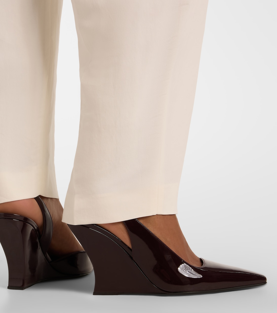 Patent leather wedge slingback pumps | Alaïa