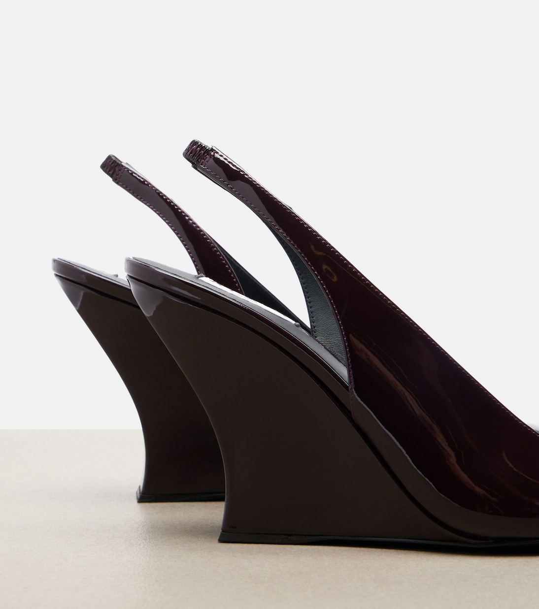 Patent leather wedge slingback pumps | Alaïa