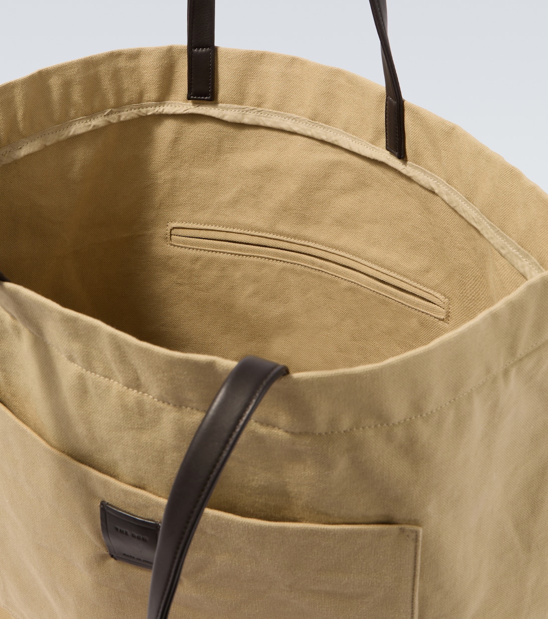 Tori leather-trimmed canvas tote bag | The Row