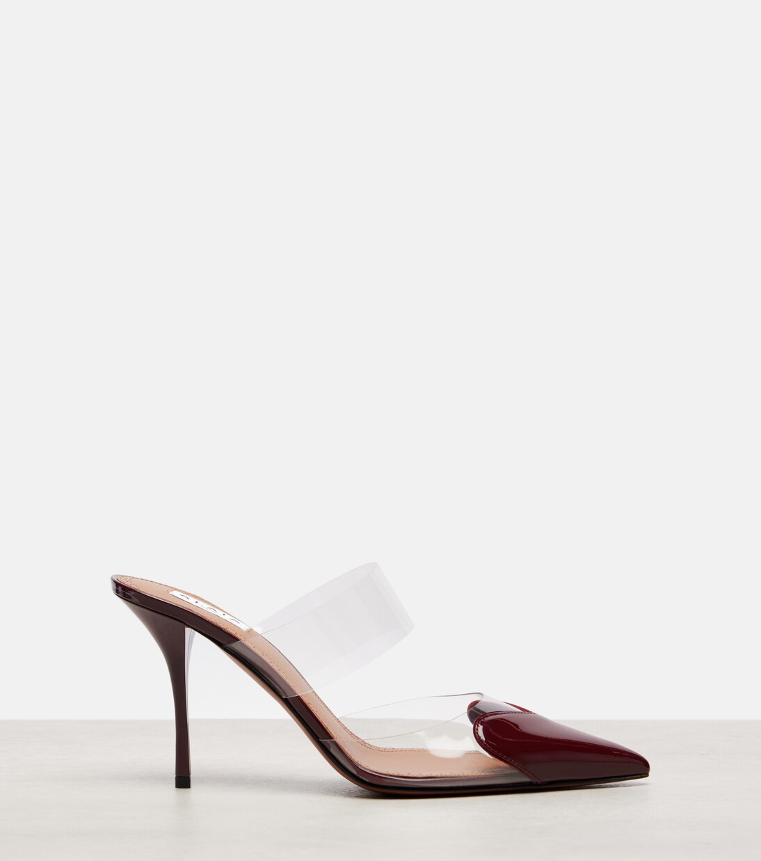 Mules Le Cœur 90 en cuir verni et PU | Alaïa