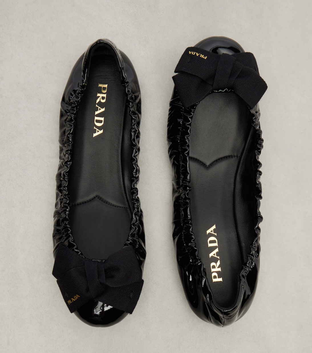 Bow-detail patent leather ballet flats | Prada