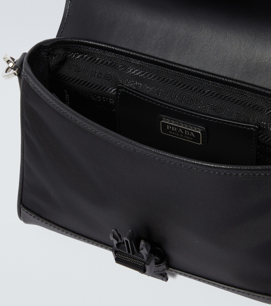 Re-Nylon leather-trimmed crossbody bag | Prada