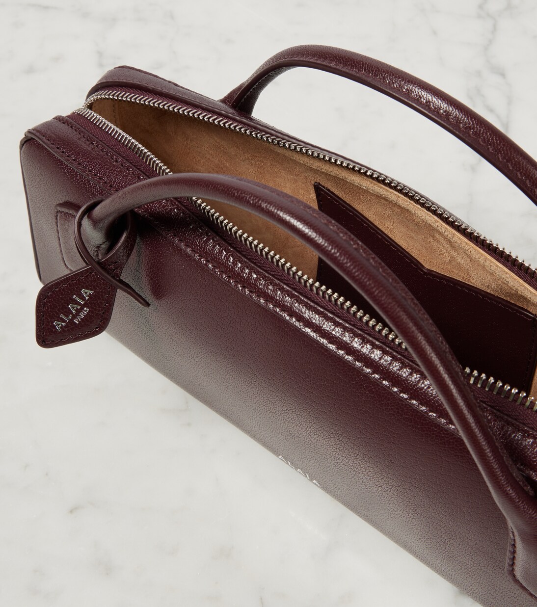 Le Teckel leather clutch | Alaïa