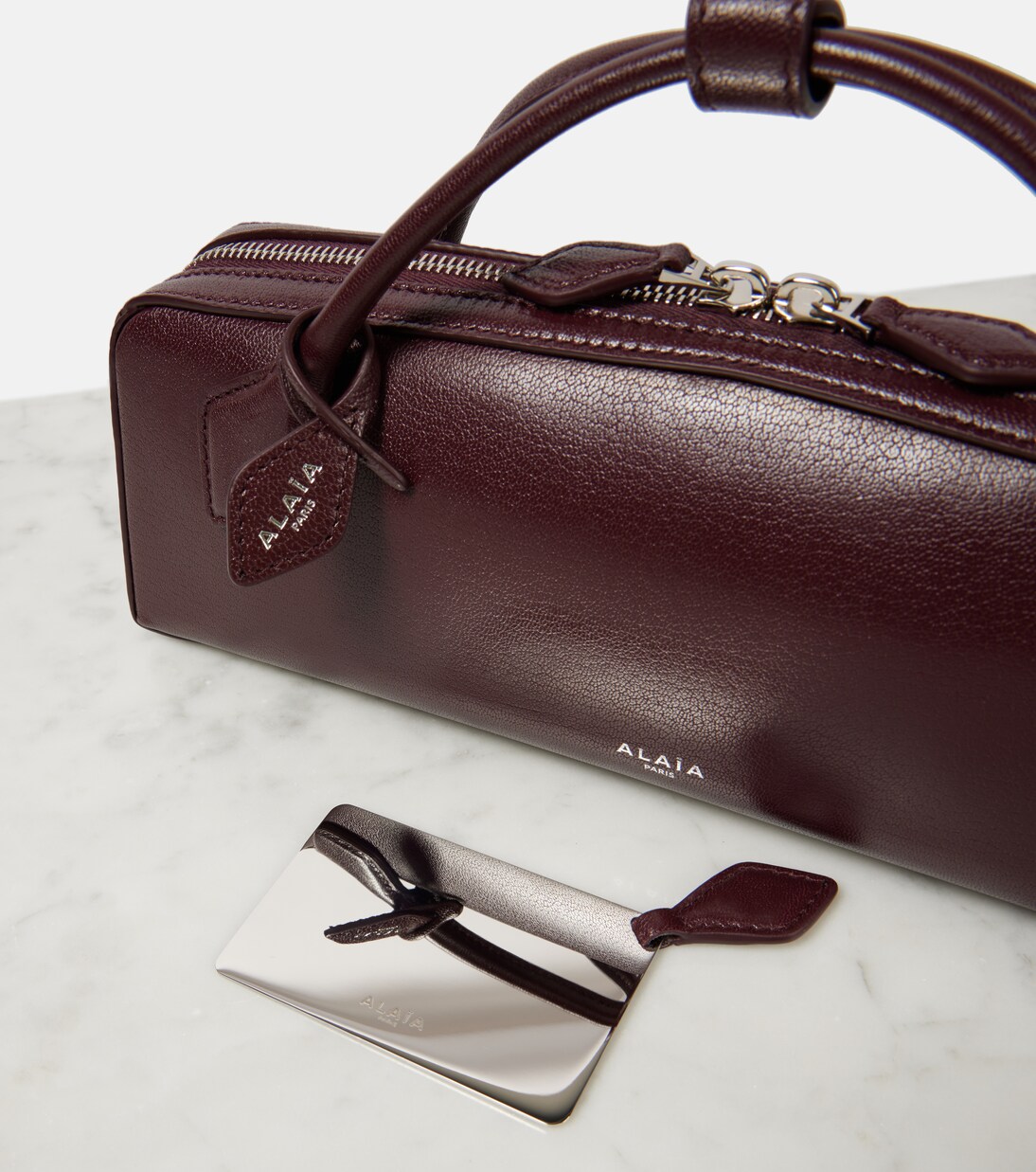 Le Teckel leather clutch | Alaïa