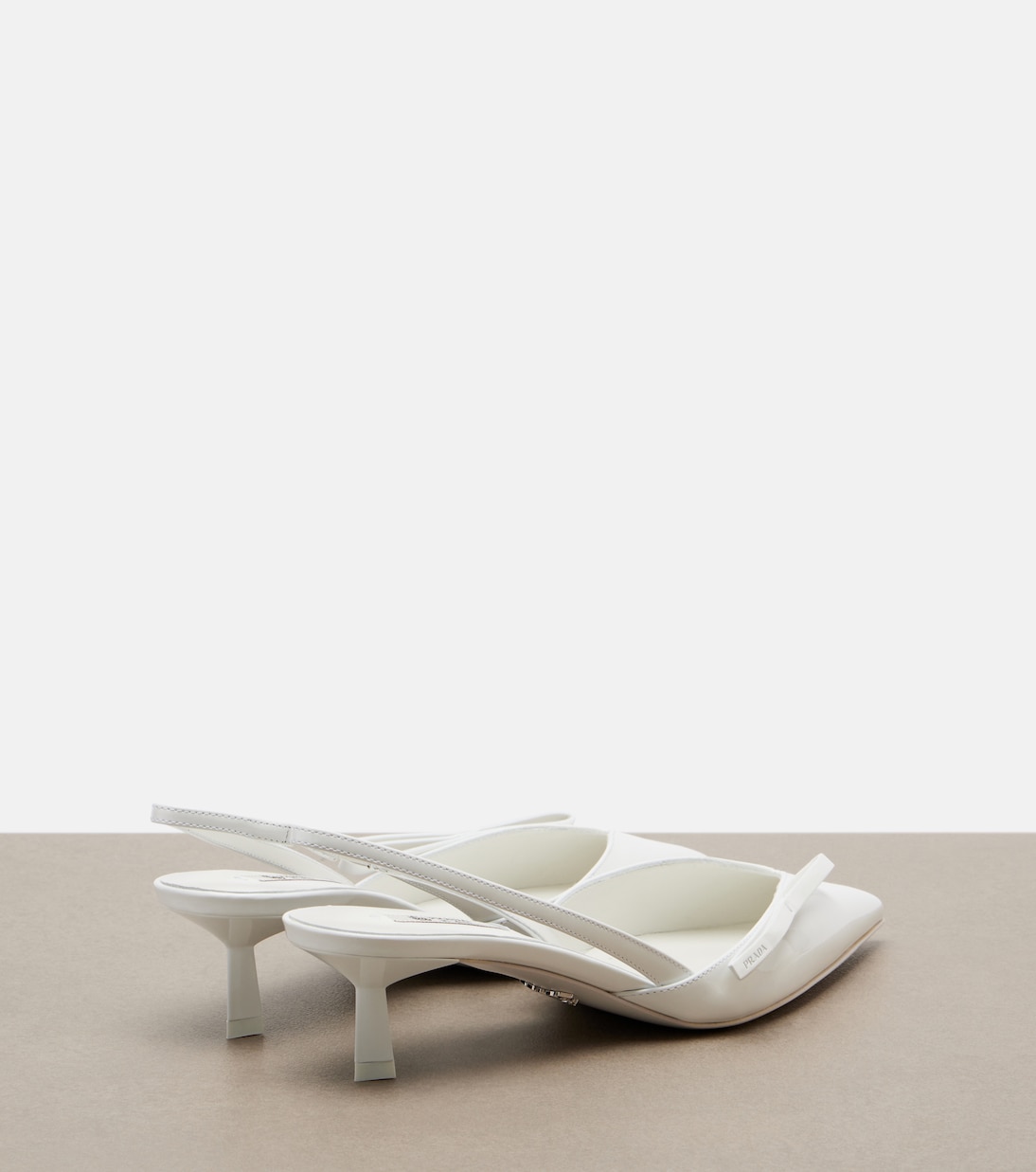 Patent leather slingback pumps | Prada