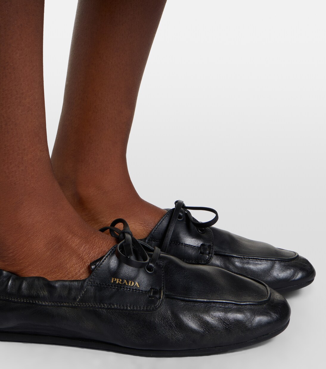 Shuffle leather boat shoes | Prada