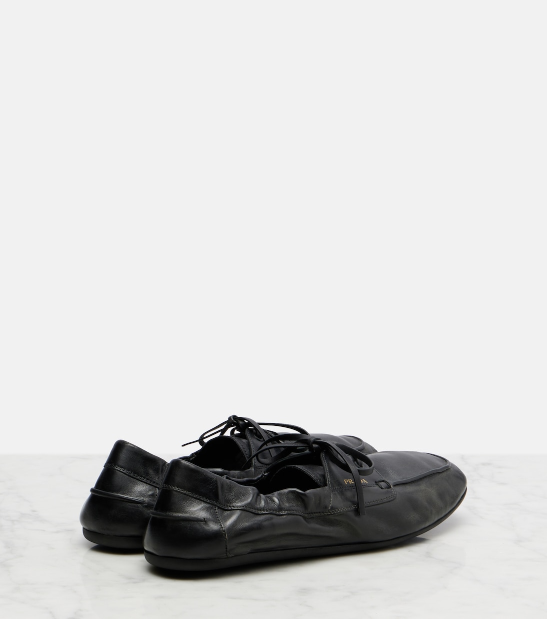 Shuffle leather boat shoes | Prada