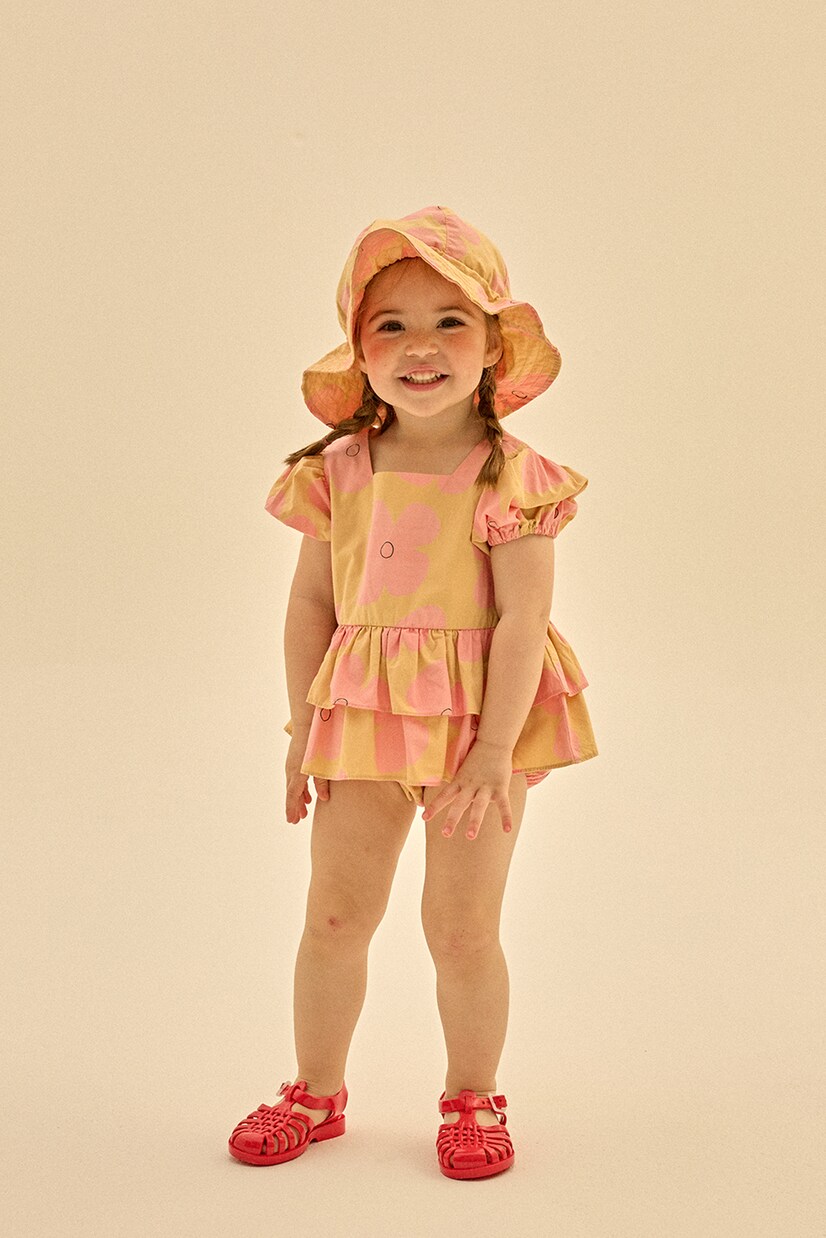 Baby printed cotton playsuit and hat set | Jellymallow