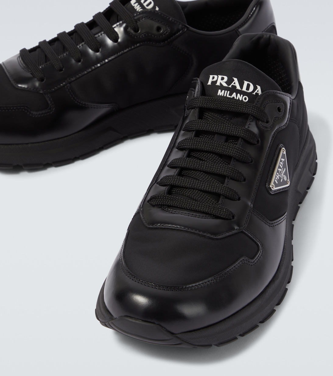 Logo leather-trimmed sneakers | Prada