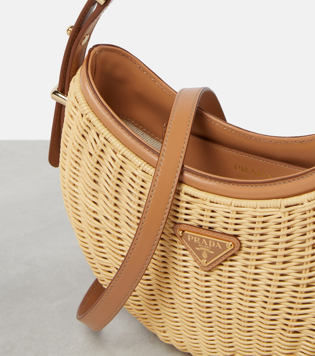 Arqué woven leather-trimmed shoulder bag | Prada