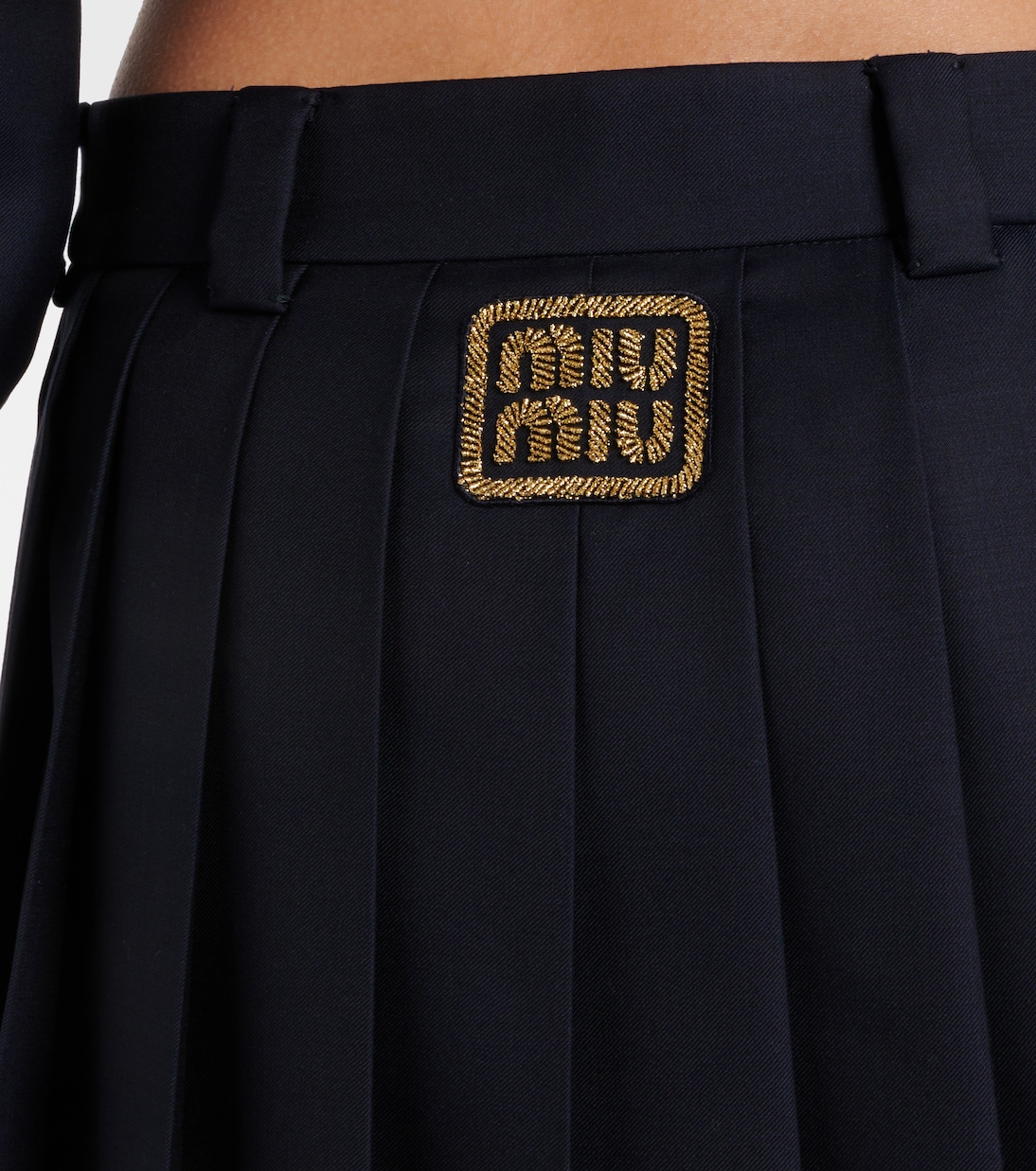 Pleated virgin wool miniskirt | Miu Miu