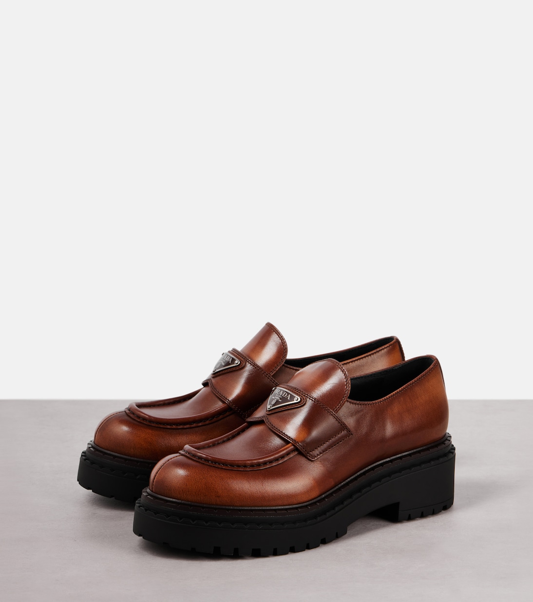 Logo leather platform loafers | Prada
