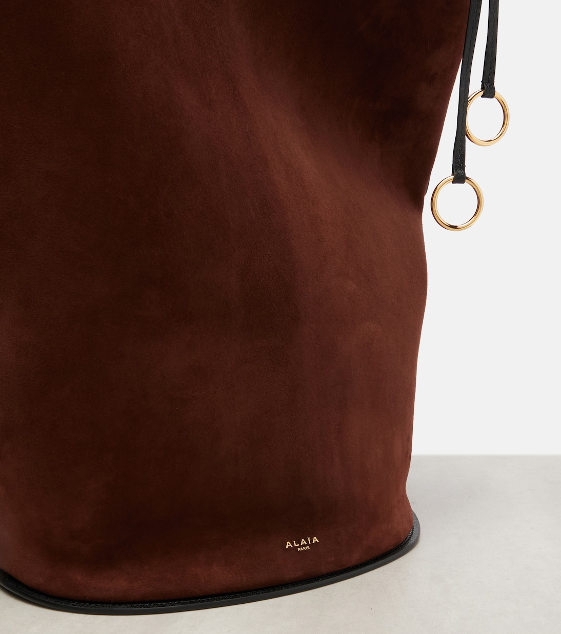 Hip Large leather-trimmed suede bucket bag | Alaïa