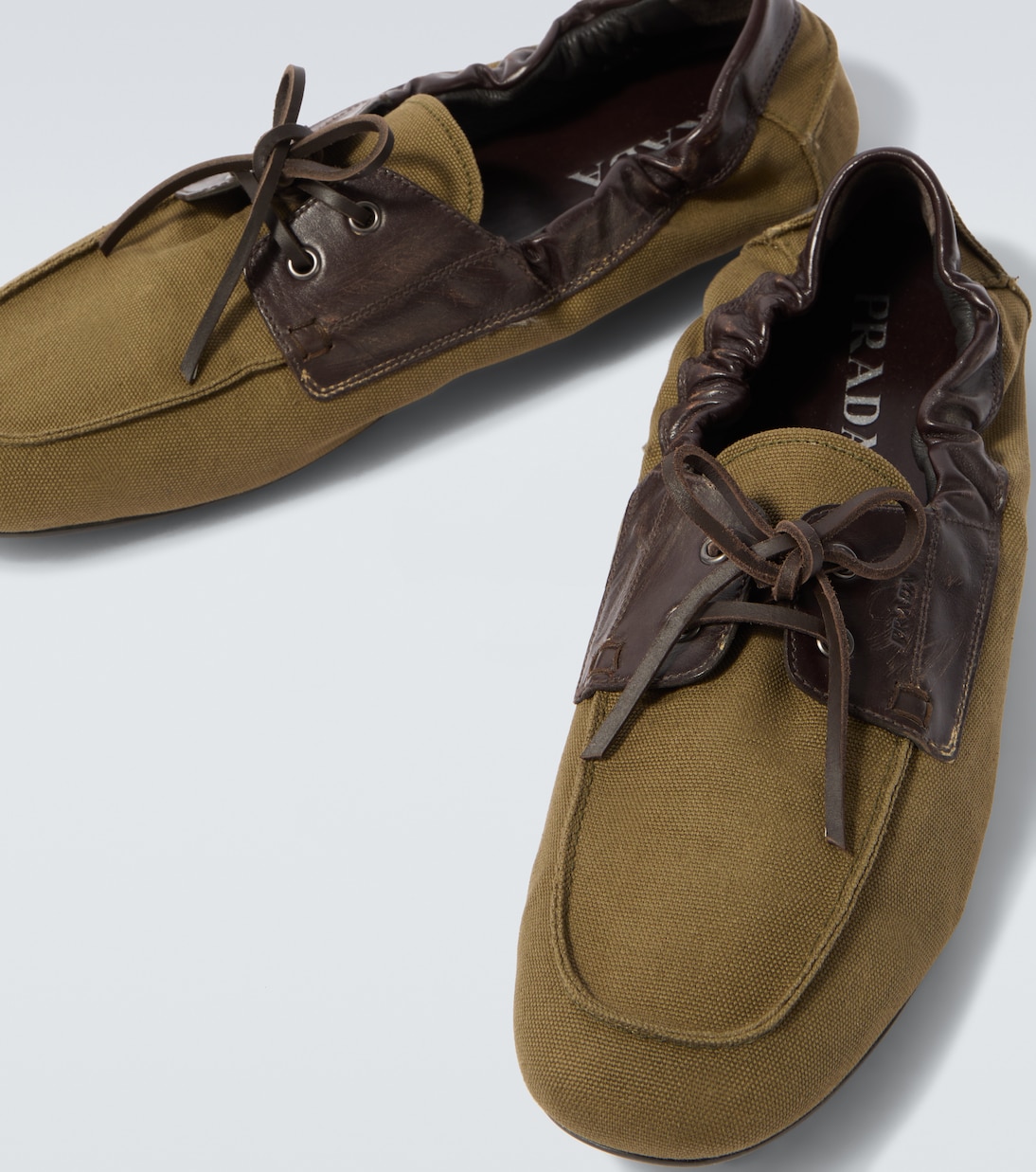 Shuffle leather-trimmed canvas boat shoes | Prada
