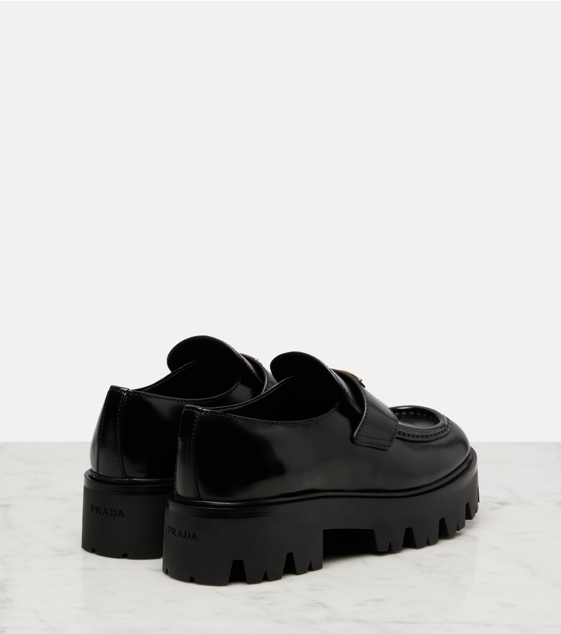 Logo leather platform loafers | Prada