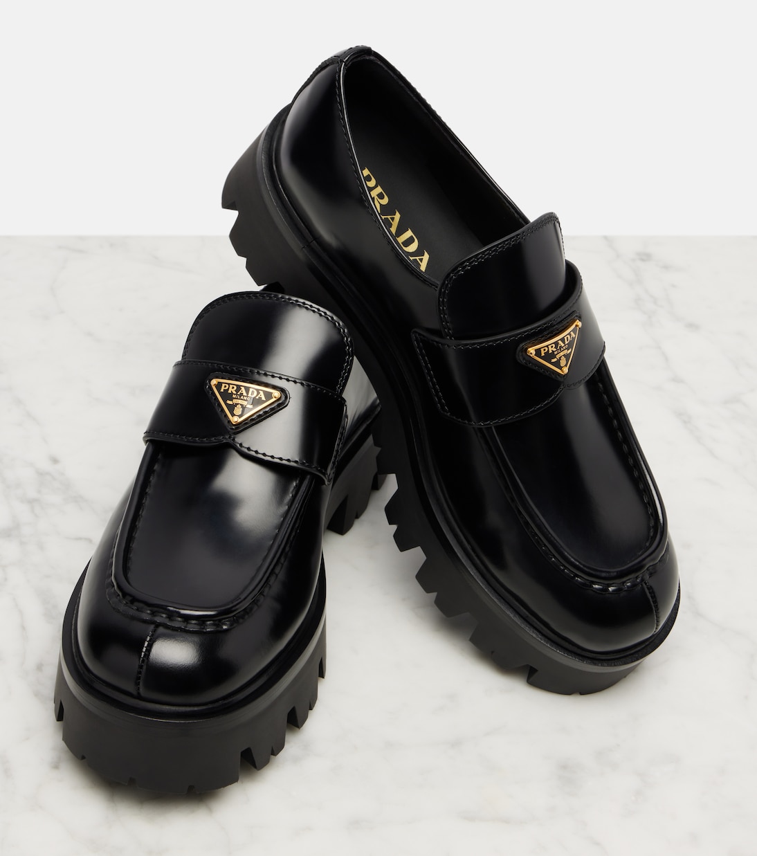 Logo leather platform loafers | Prada