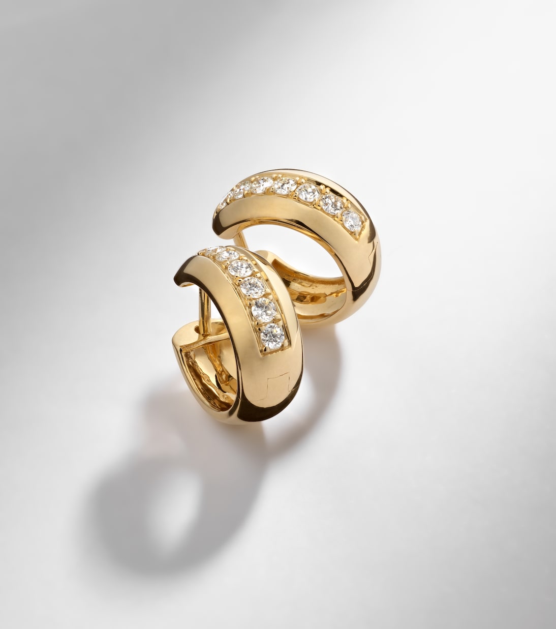 14kt gold huggie earrings with diamonds | Stone and Strand
