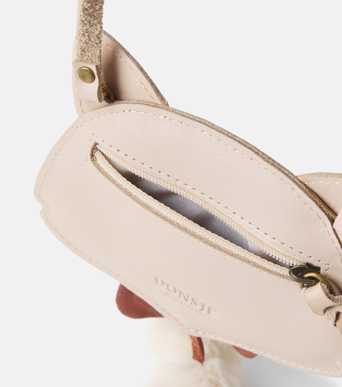 Pua pompom-trimmed metallic leather backpack | Donsje