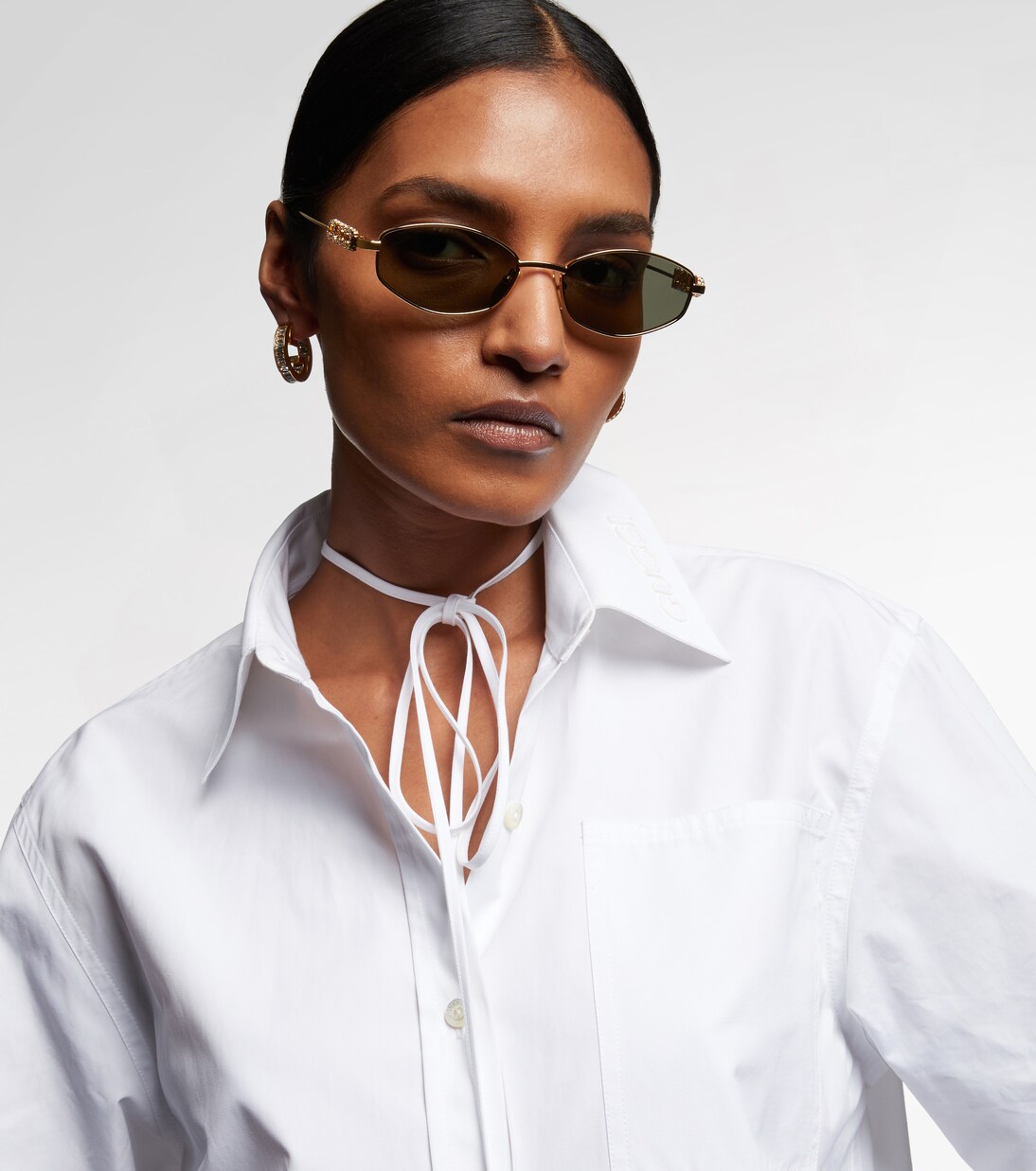 Ovale Sonnenbrille mit Kristallen | Gucci